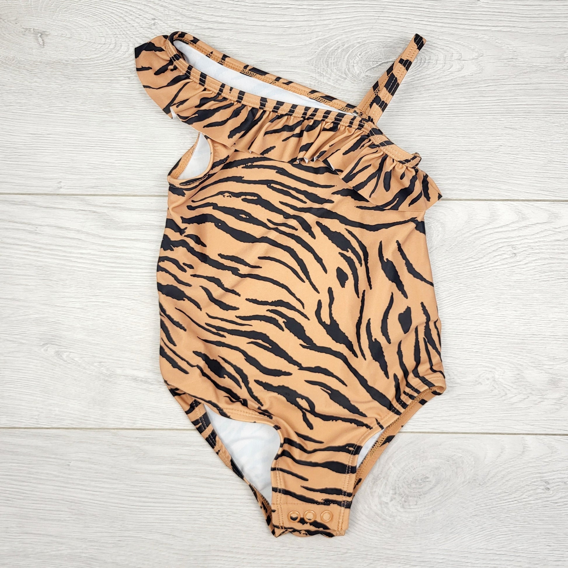 PBRQ1 - Maillot de bain une pièce asymétrique à rayures tigre beige Carters. Taille 24 mois.