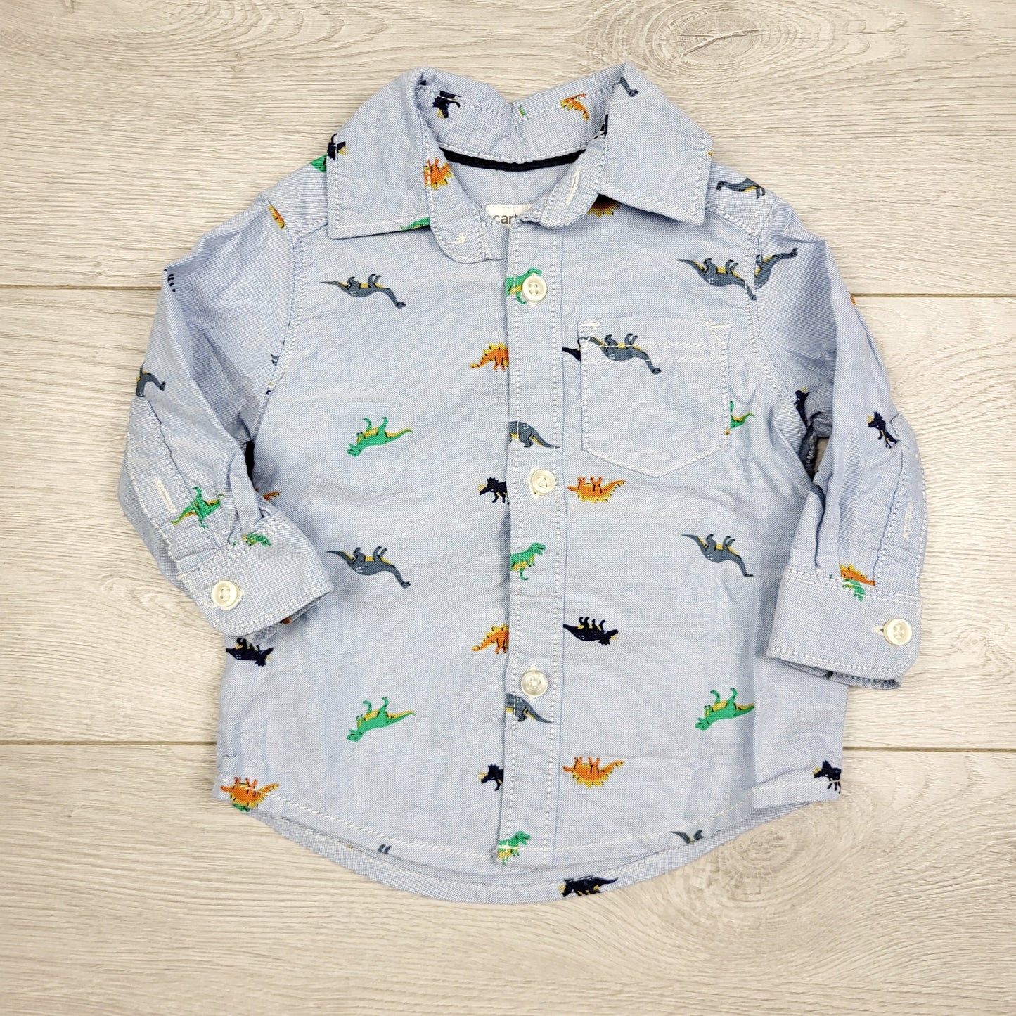 RBEN2 - Carters blue Oxford style button down dinosaur shirt. Size 3 months