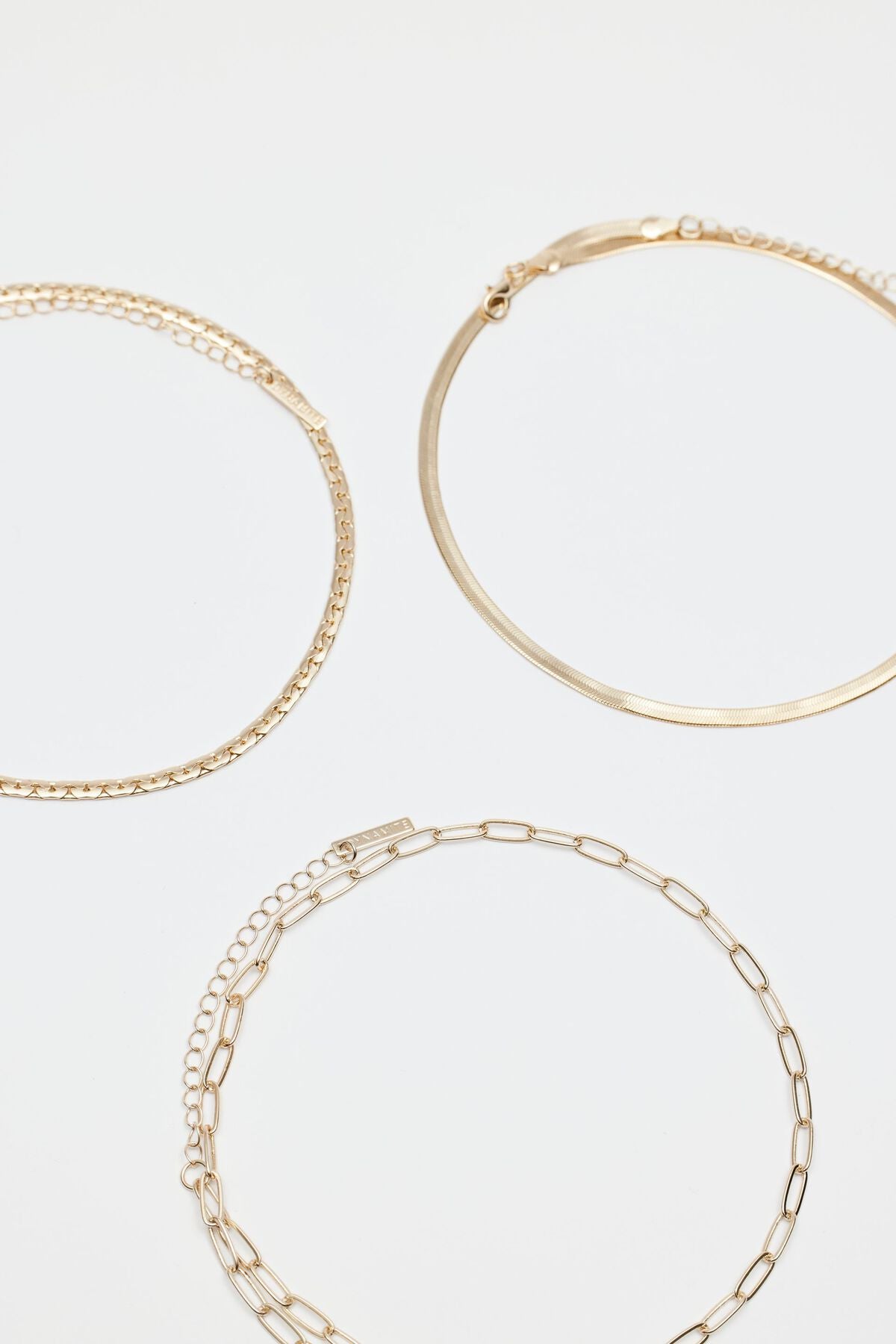 Collier à plusieurs niveaux avec trombone, serpent et chaîne plate