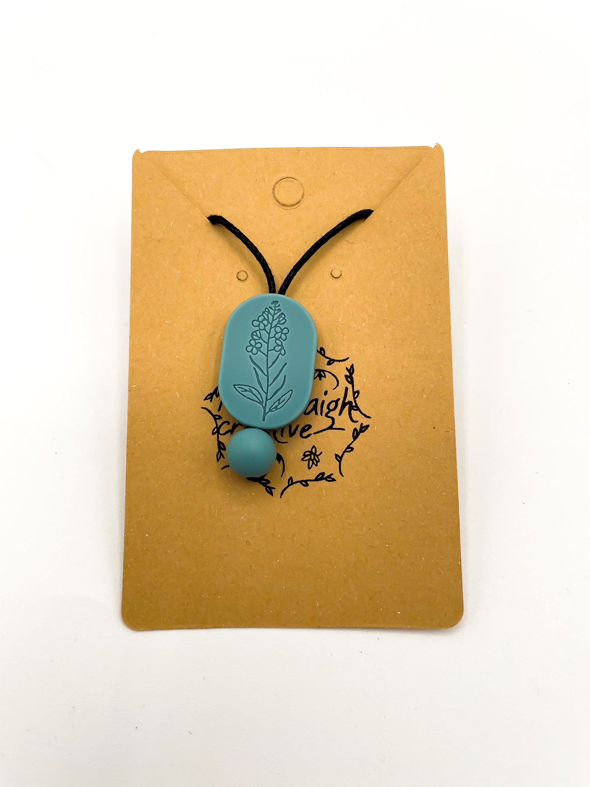 Collier à mâcher ovale à motif floral de moutarde bleue