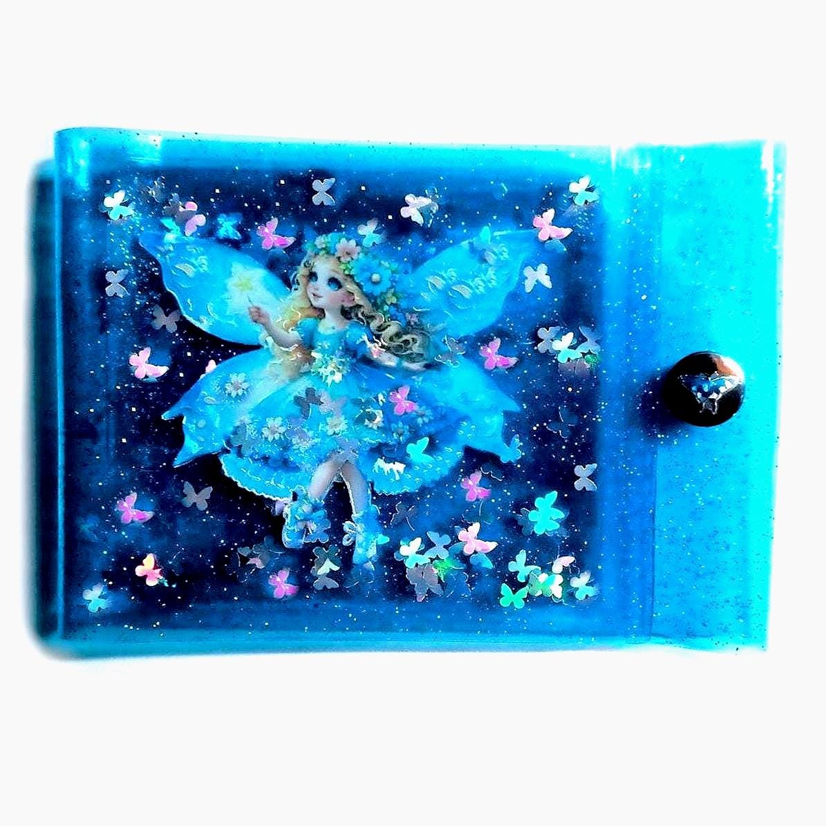 Liquid Glitter Jelly Elf Wallet. Multicoloured Flower Fairy + Holographic Butterfly Shimmer Float in Metallic Baby Blue Vinyl. LED Neon Case