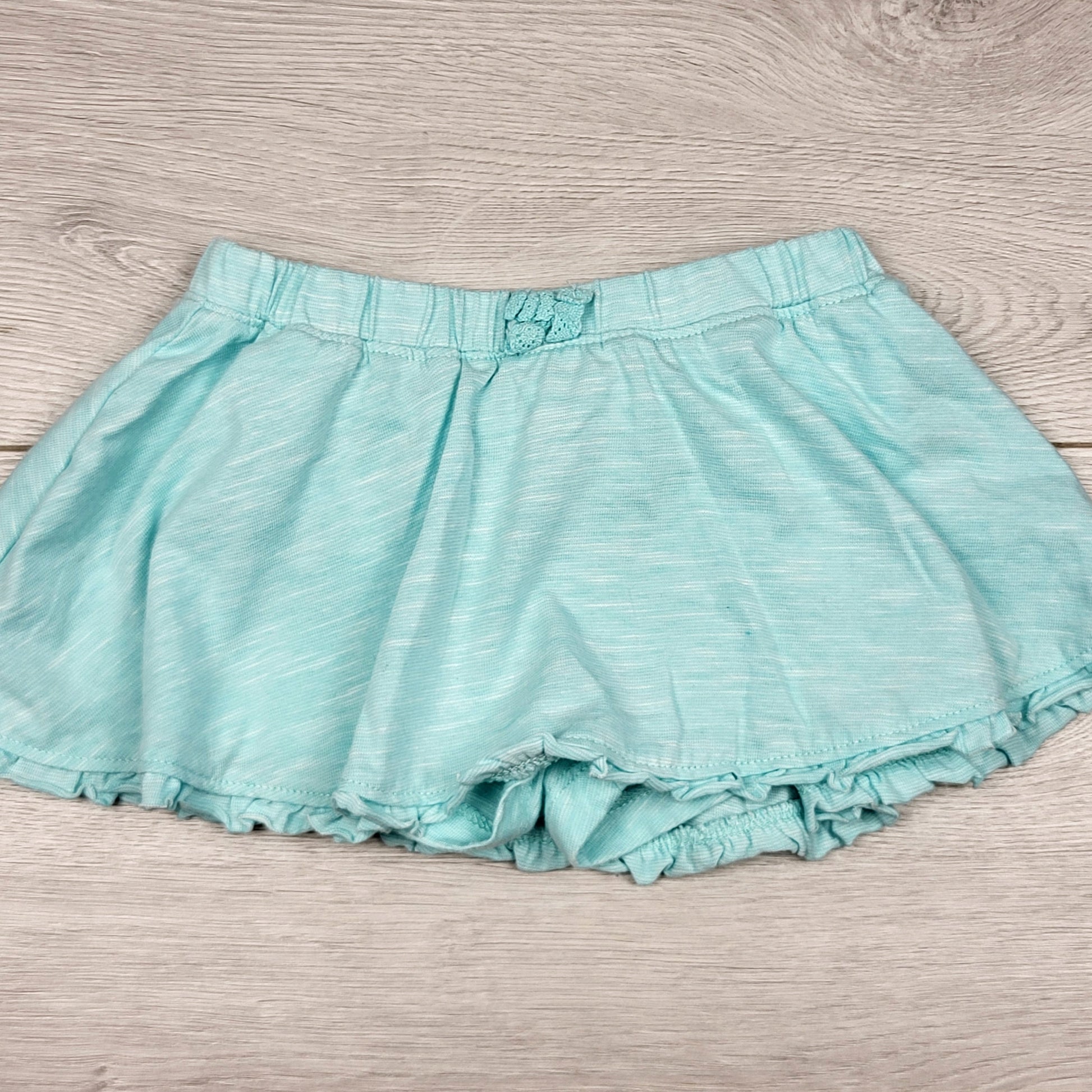 MWLL11 - Jupe George bleu pâle avec short intégré. Taille 6-12 mois