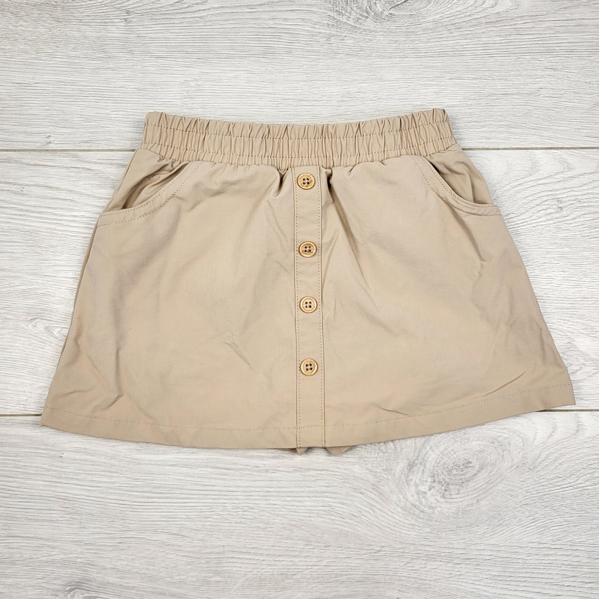 PBRQ1 - Jupe beige Pekkle avec short intégré. Taille 3T