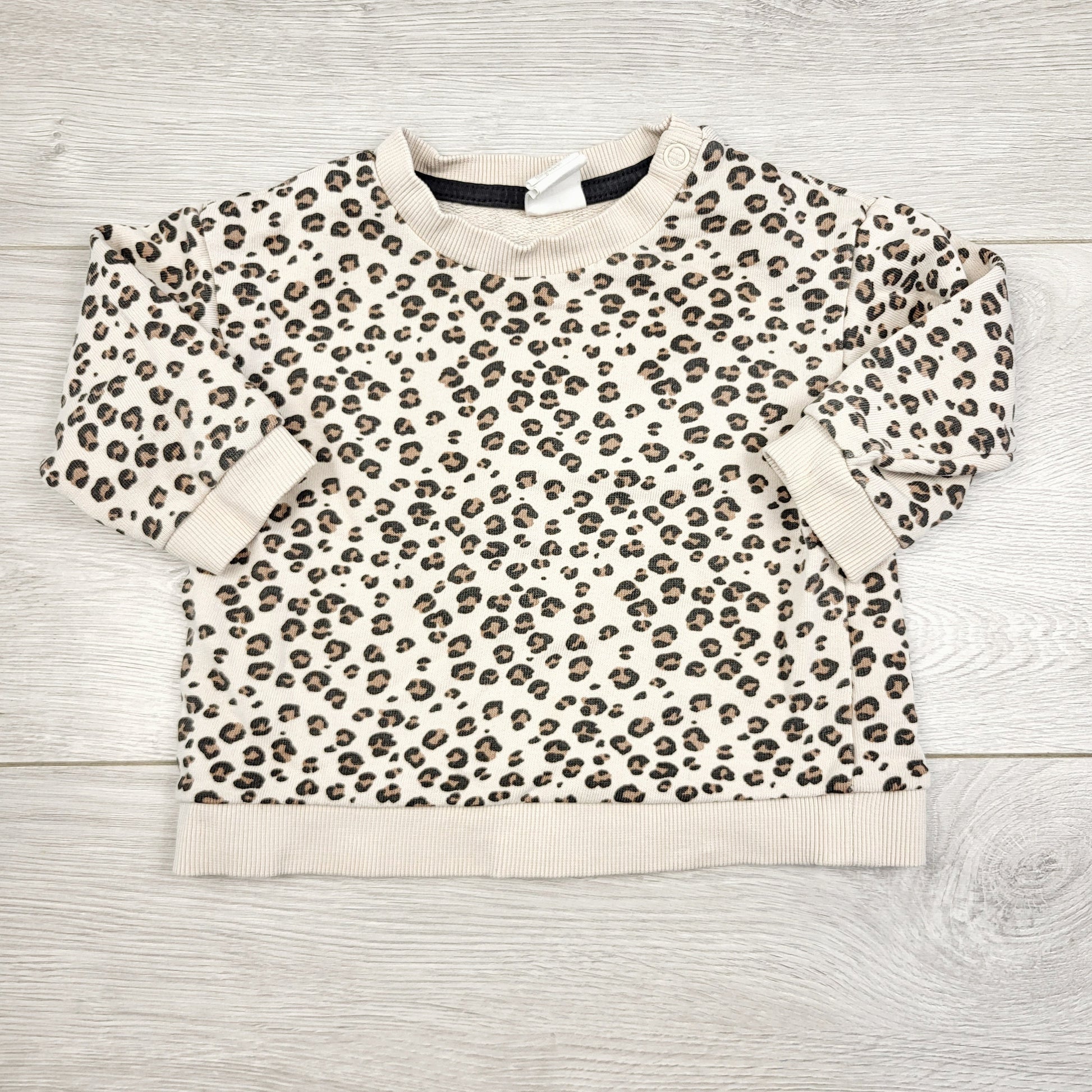 ECRS34 - Sweat-shirt imprimé léopard H&amp;M. Taille 4-6 mois.