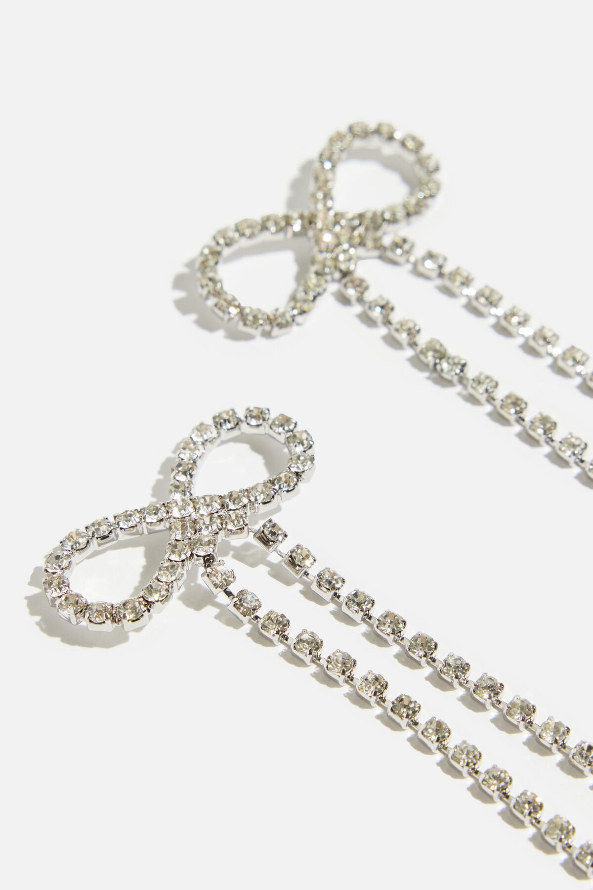 Boucles d'oreilles délicates en forme de nœud suspendu