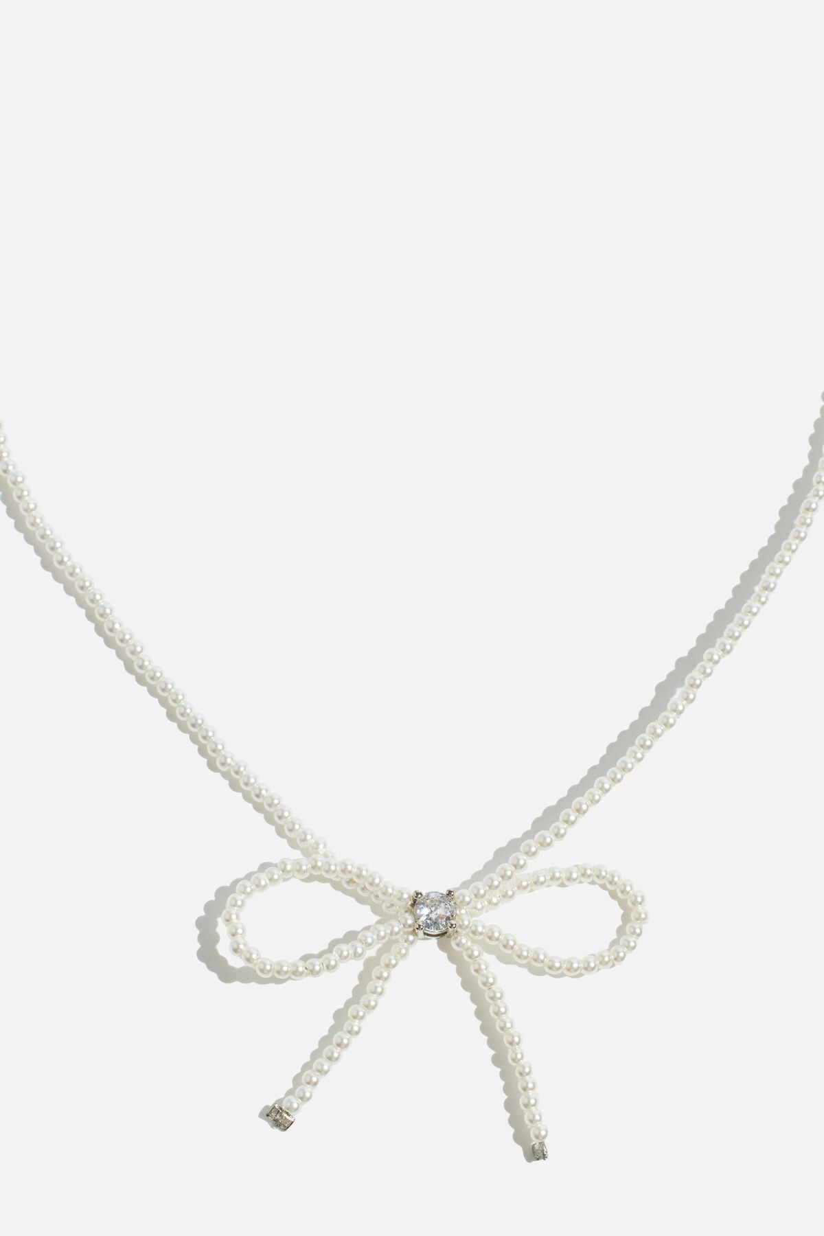 Collier de perles en forme de nœud