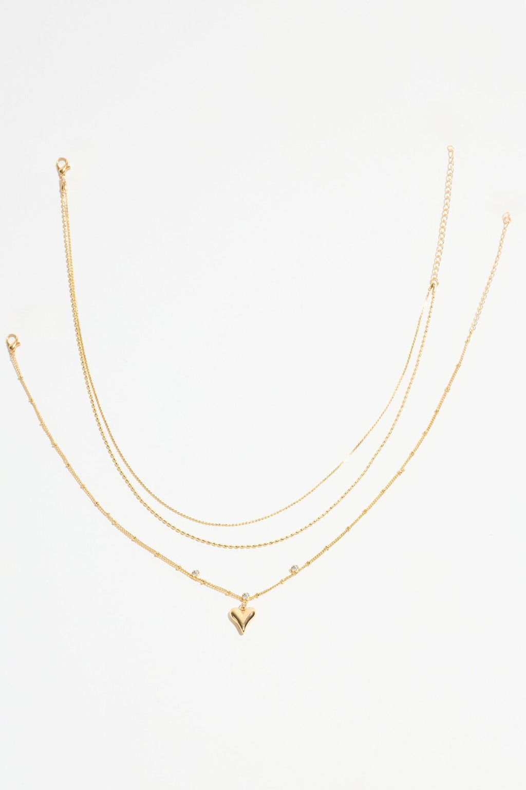 Collier à pois avec pendentif en forme de cœur superposé