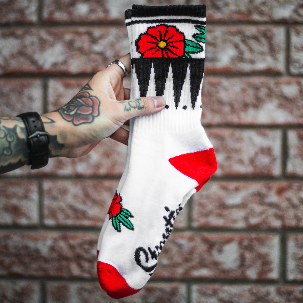 Chaussettes blanches à fleurs géométriques