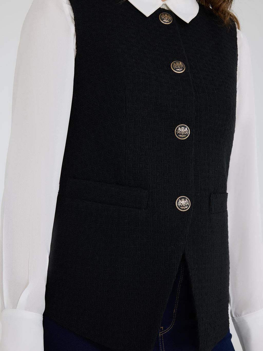 Gilet boutonné en boucle sur le devant