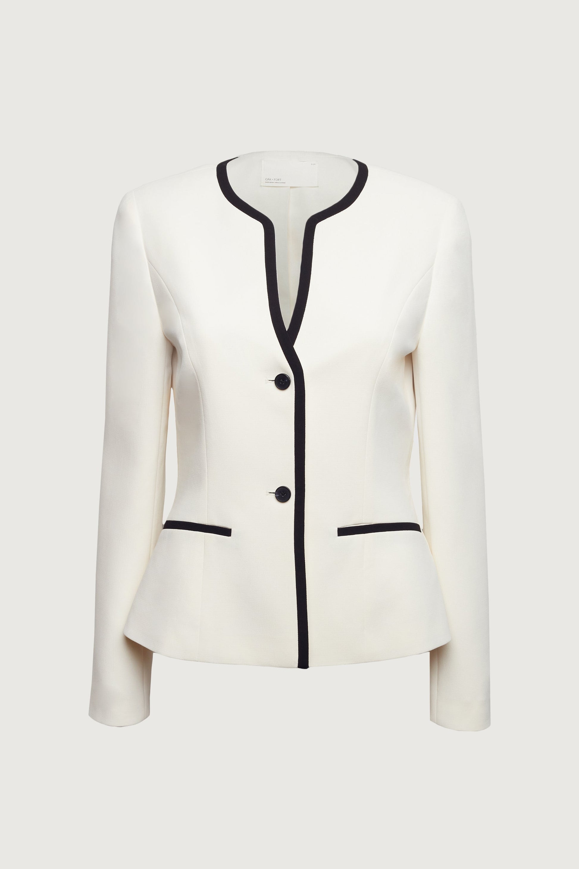 Blazer sans col à boutons sur le devant et bordure contrastante
