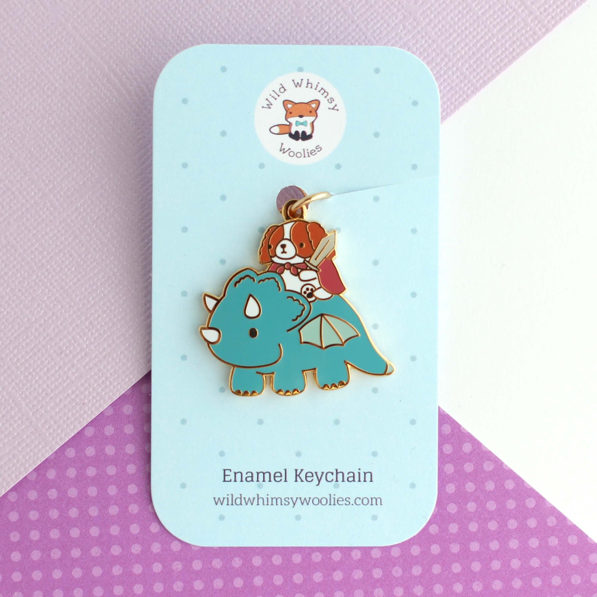 Porte-clés en émail Cavalier King Charles Spaniel chevauchant un dragon (sarcelle)