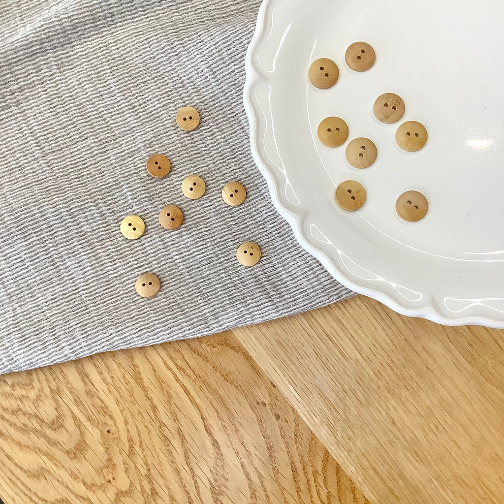 Elan ; Bouton à 2 trous, naturel - 9/16"