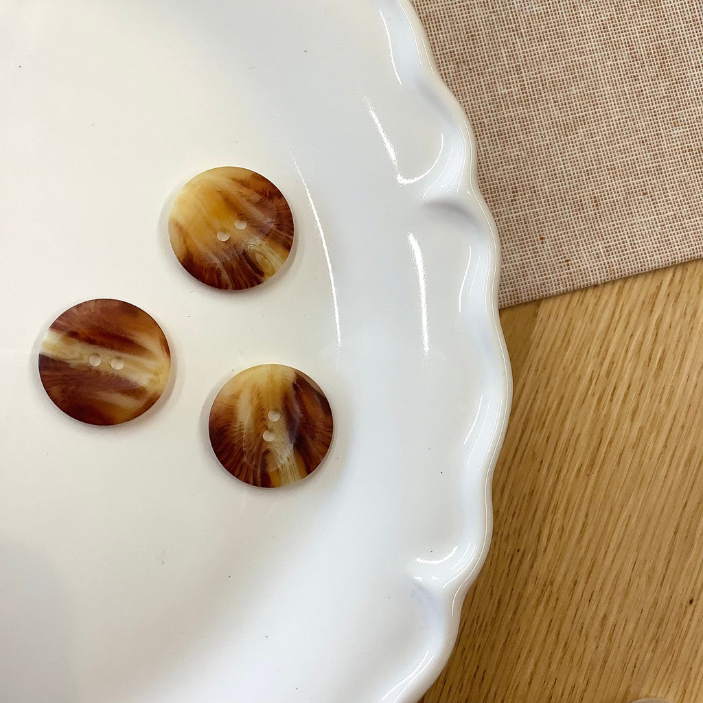 Elan ; Bouton à 2 trous, marron, 23 mm