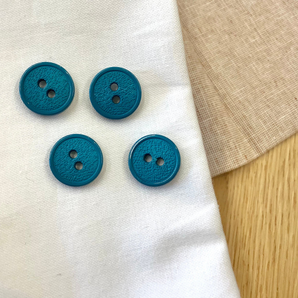 Elan ; bouton à 2 trous, bleu sarcelle, 15 mm