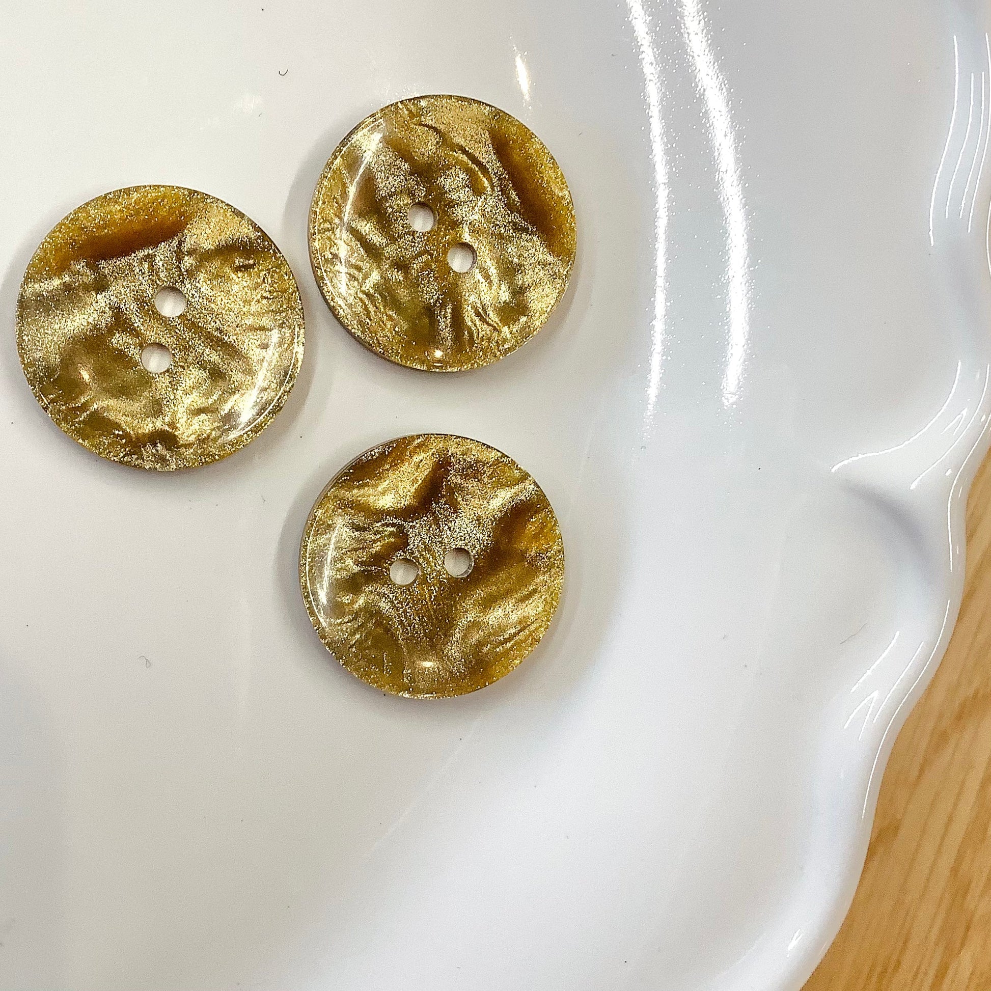 Elan ; Bouton 2 trous, doré, 23 mm