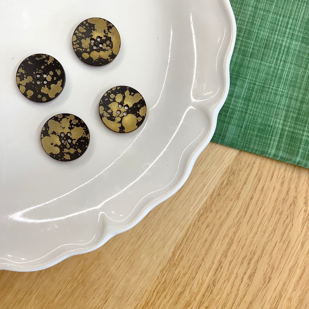 Elan ; Bouton 4 trous, noir et or, 23 mm