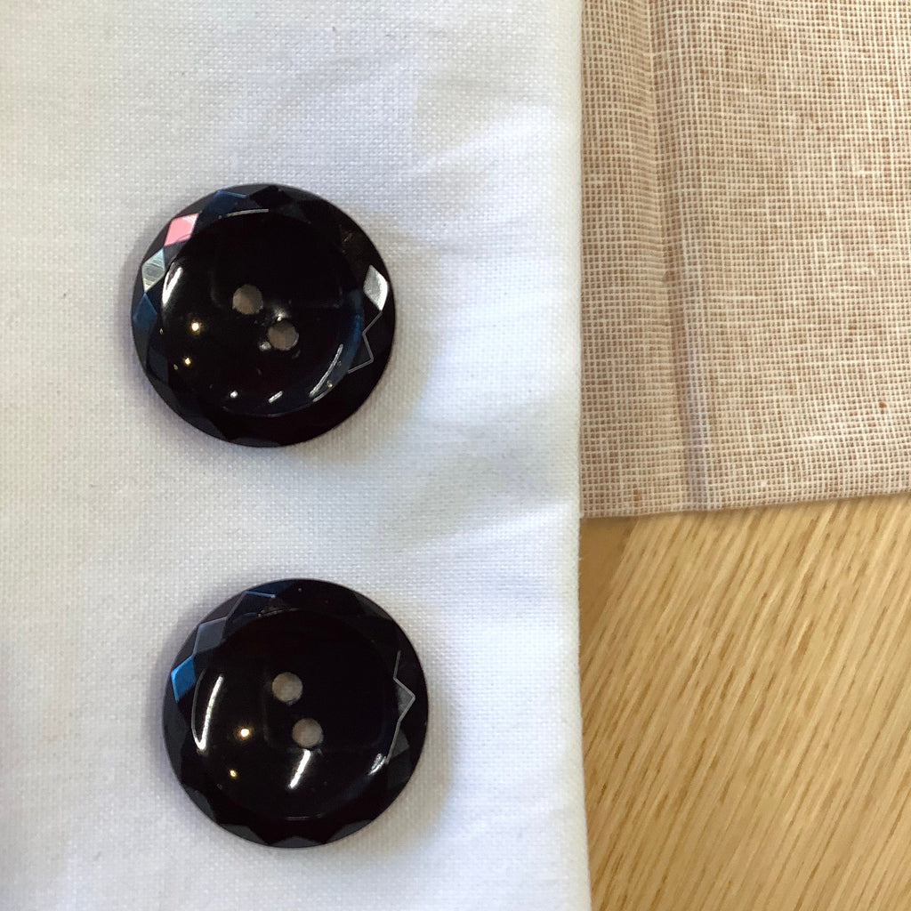 Elan ; Bouton à 2 trous, noir, 23 mm