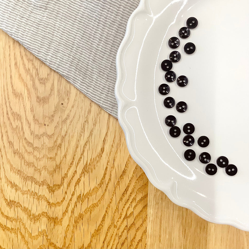 Elan ; Bouton à 2 trous, noir, 9 mm