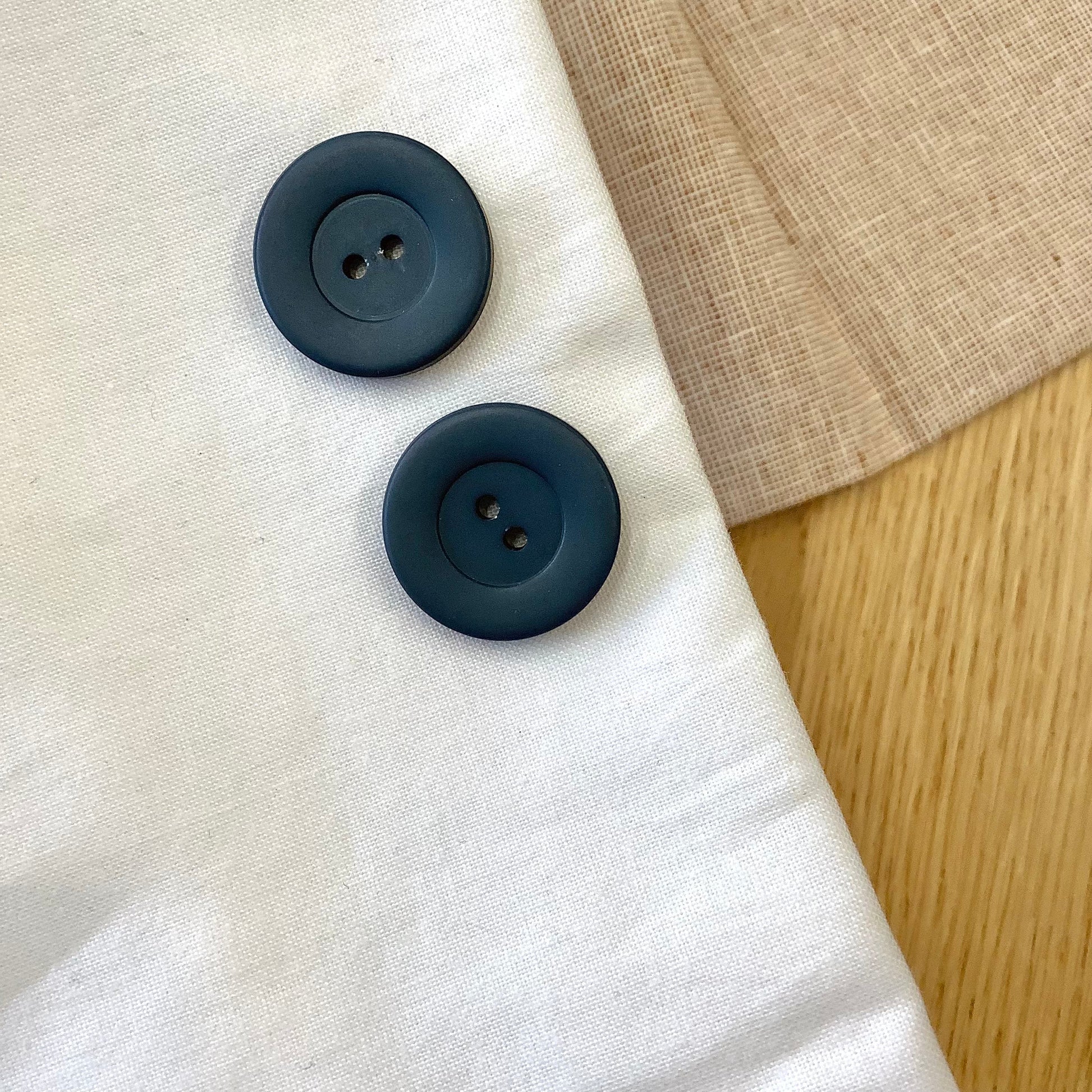 Elan ; bouton à 2 trous, bleu sarcelle, 23 mm