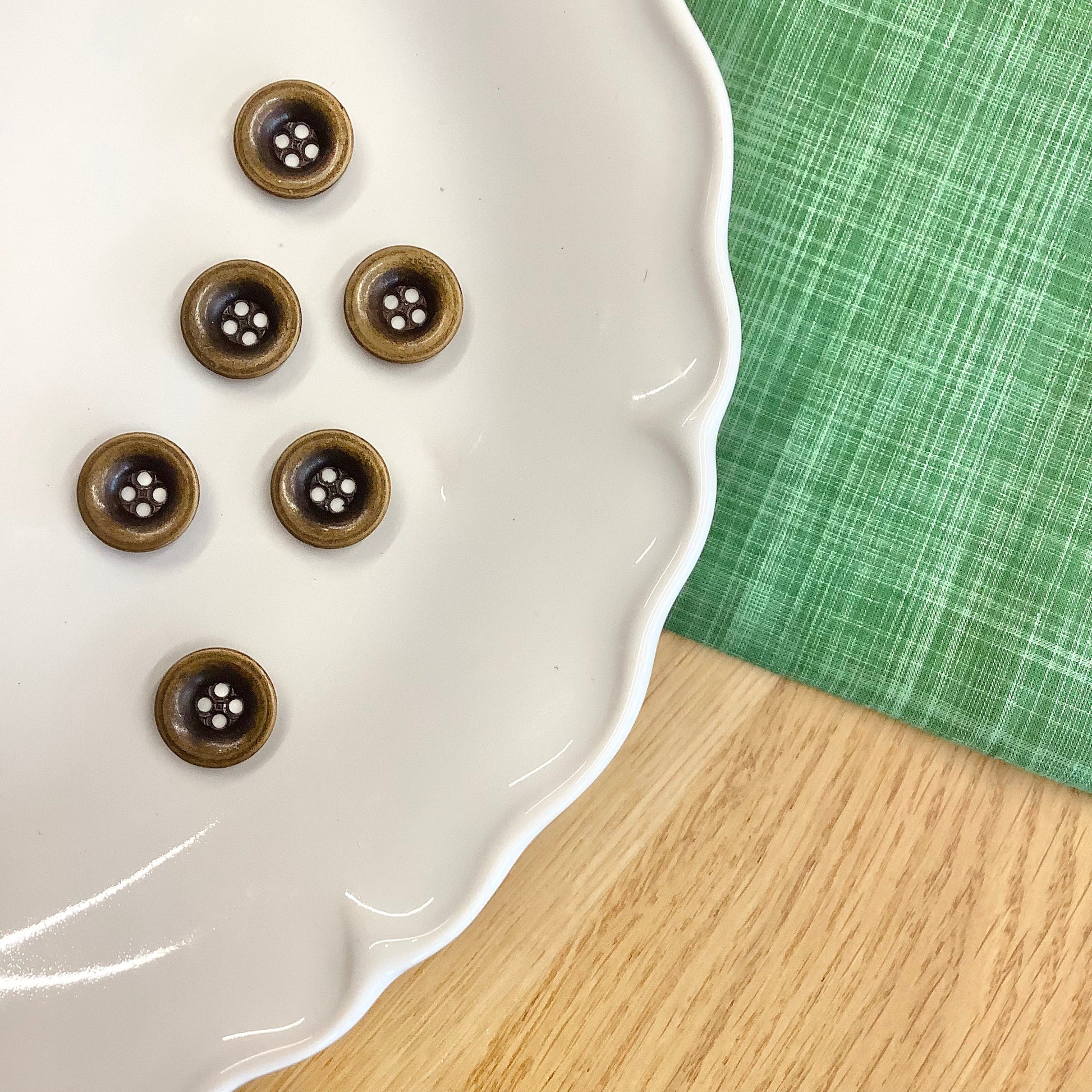 Elan ; Bouton 4 trous, bronze, 15 mm