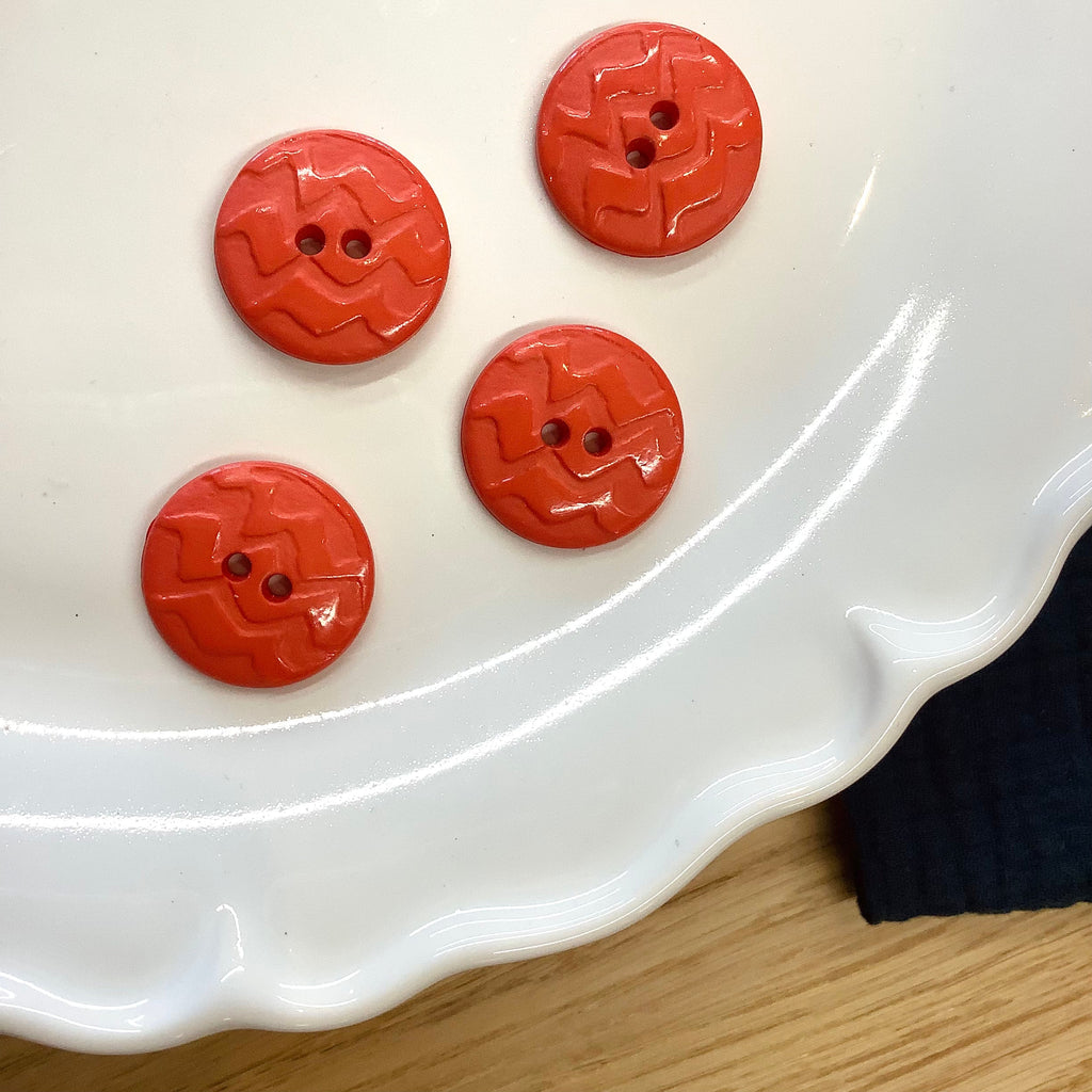 Elan ; Bouton à 2 trous, corail, 23 mm