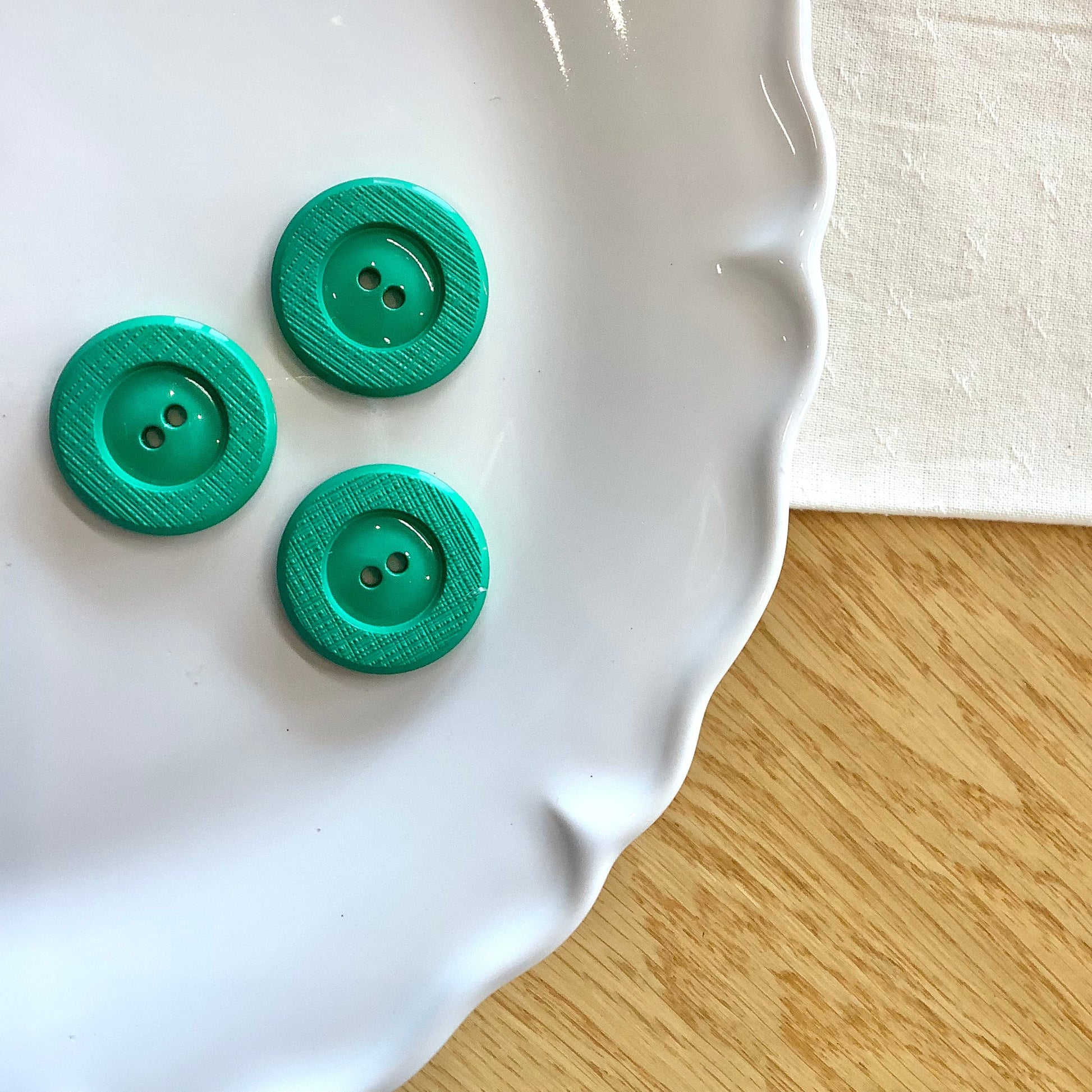 Elan ; bouton à 2 trous, vert, 25 mm