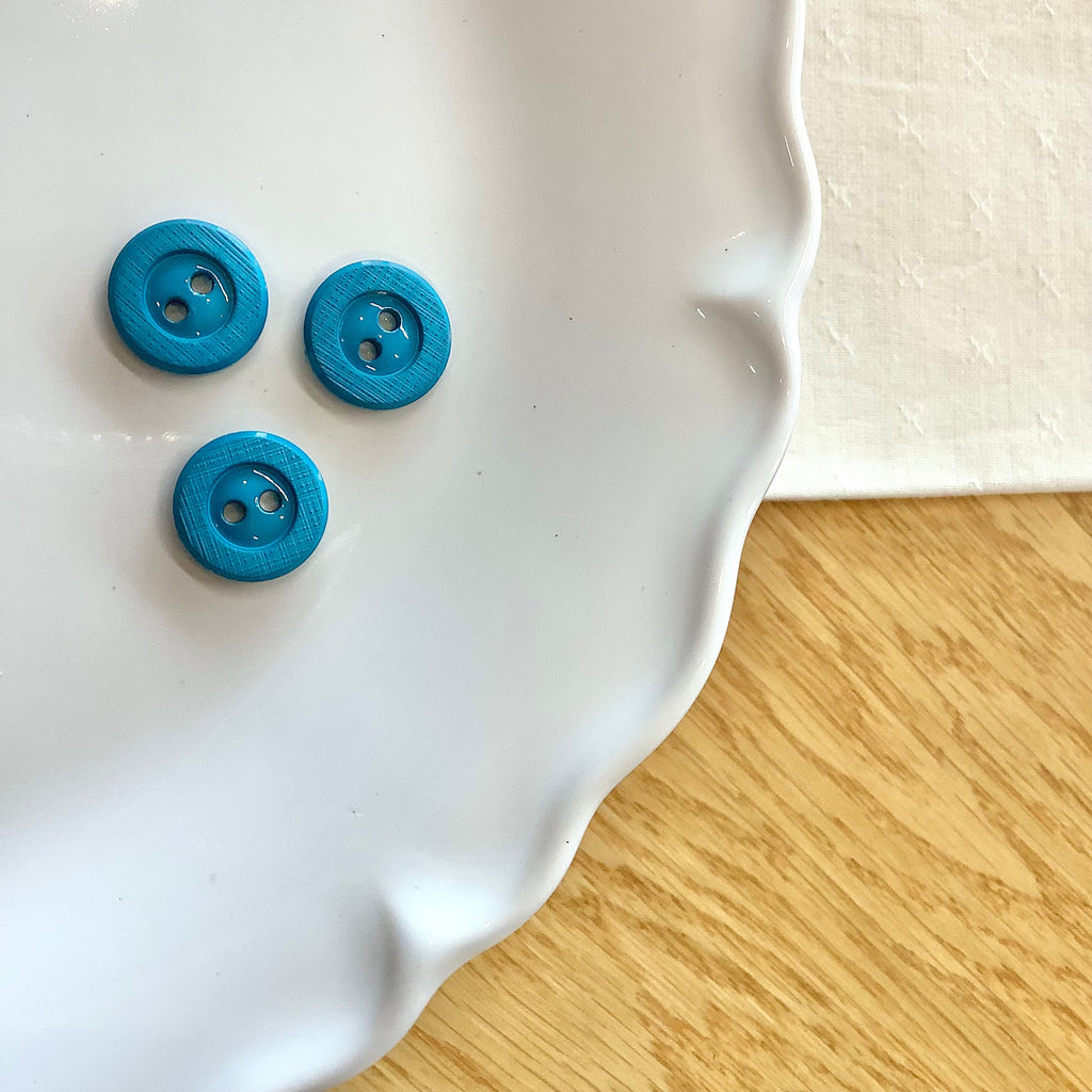 Elan ; bouton à 2 trous, turquoise, 15 mm