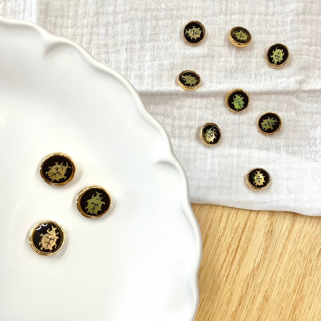 Elan ; Bouton à tige, noir et or, 15 mm