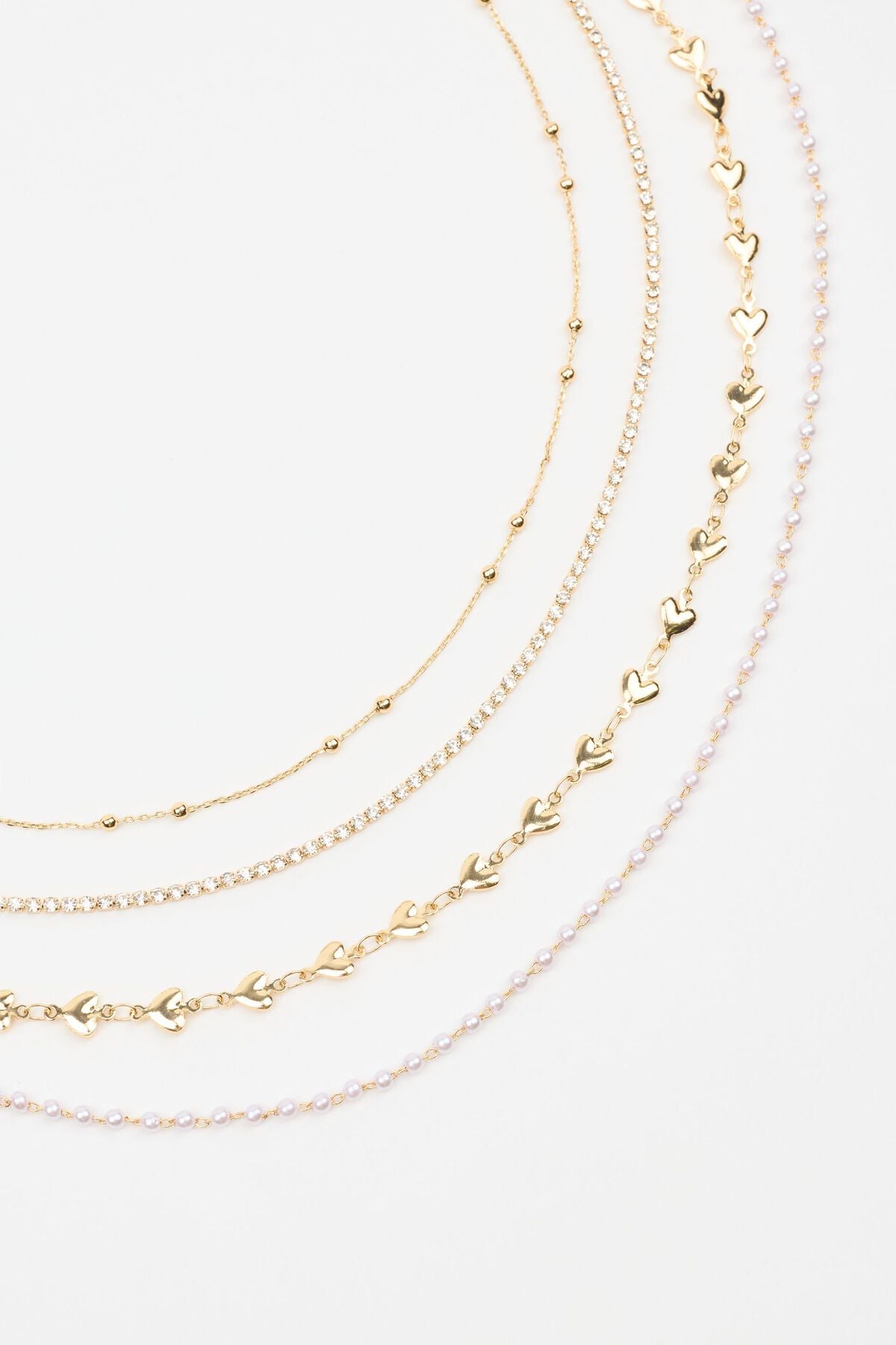 Ensemble de 4 chaînes cœurs, pierres précieuses et perles