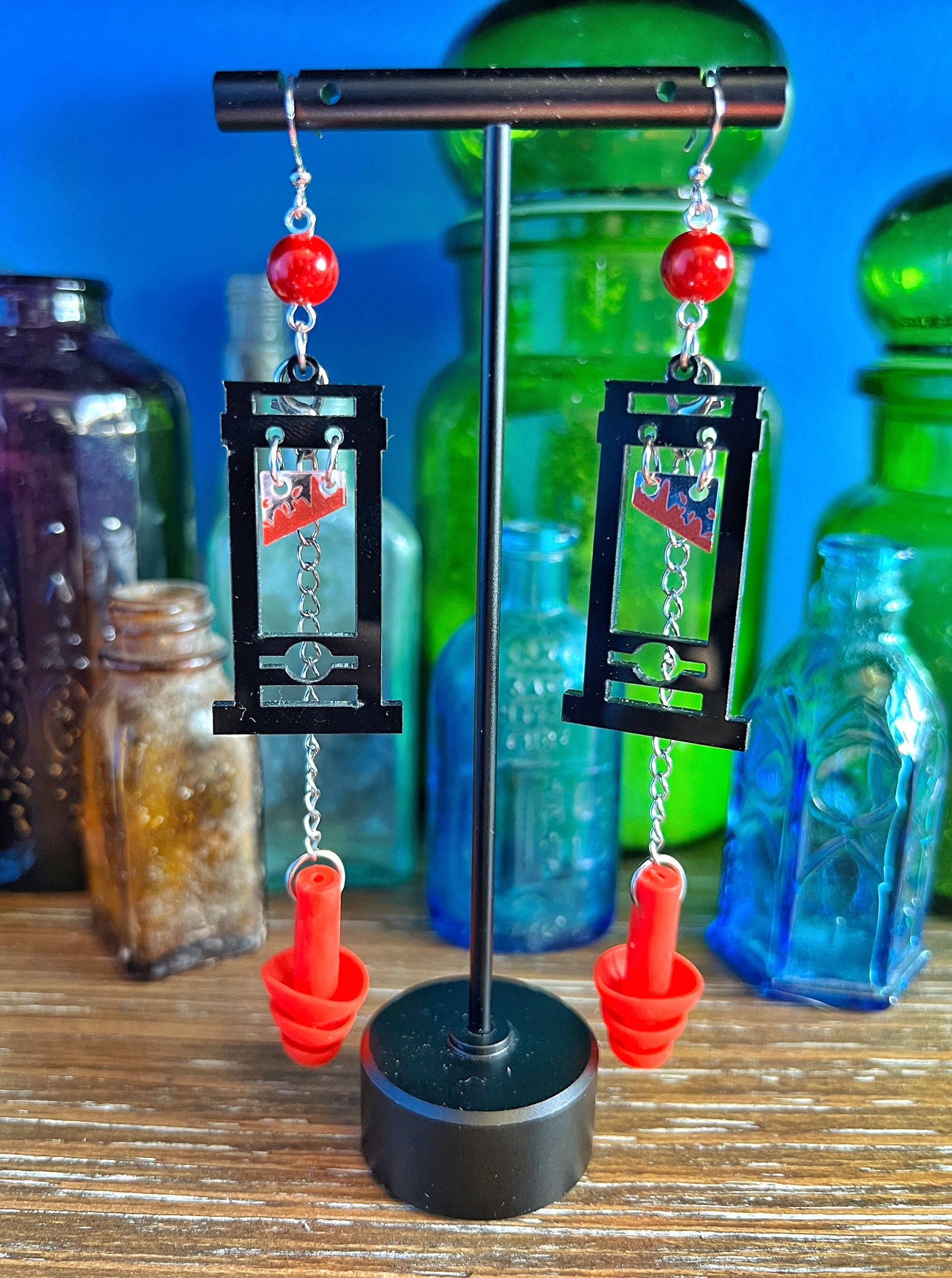 Boucles d'oreilles Guillotine – Style audacieux avec support sensoriel intégré 