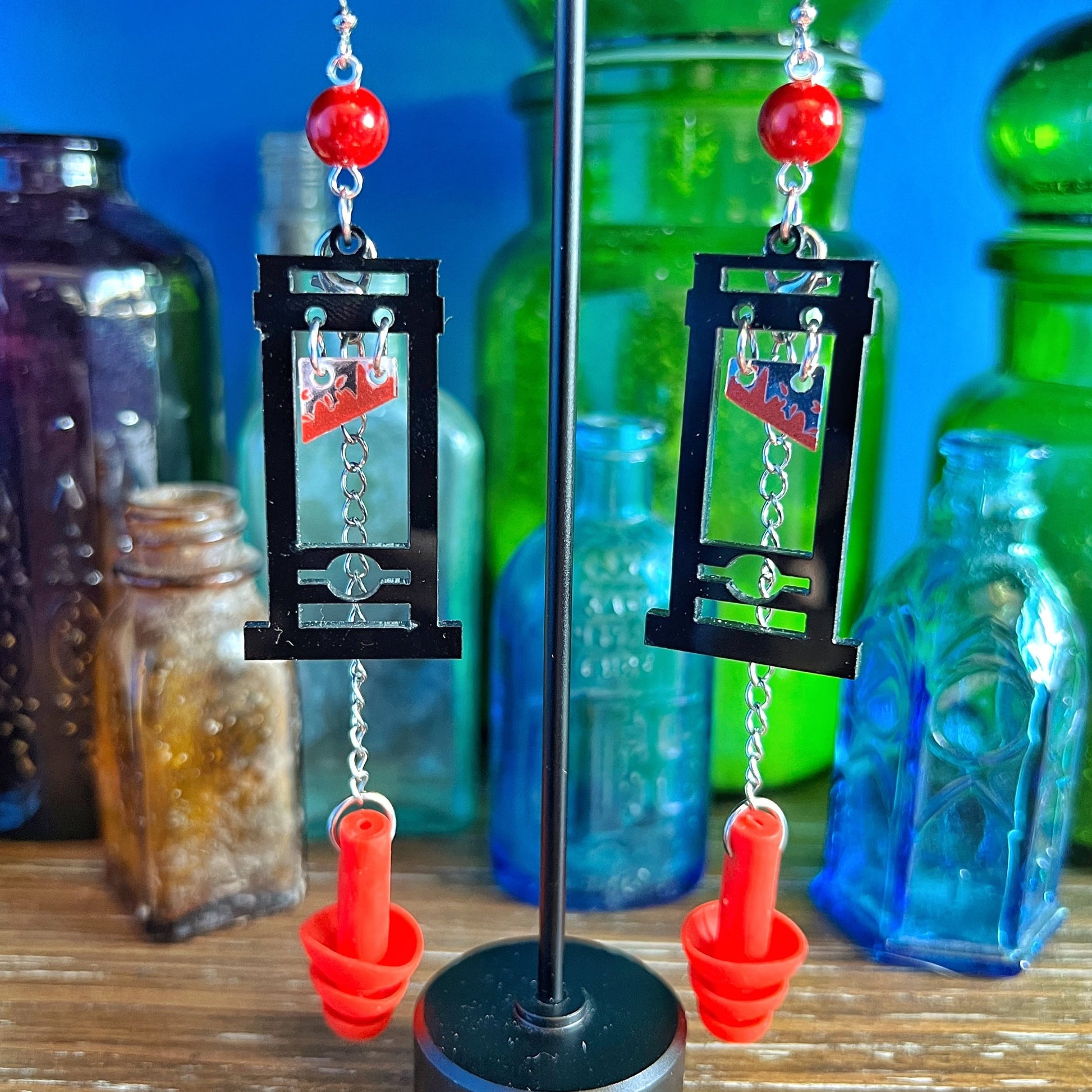 Boucles d'oreilles Guillotine – Style audacieux avec support sensoriel intégré 
