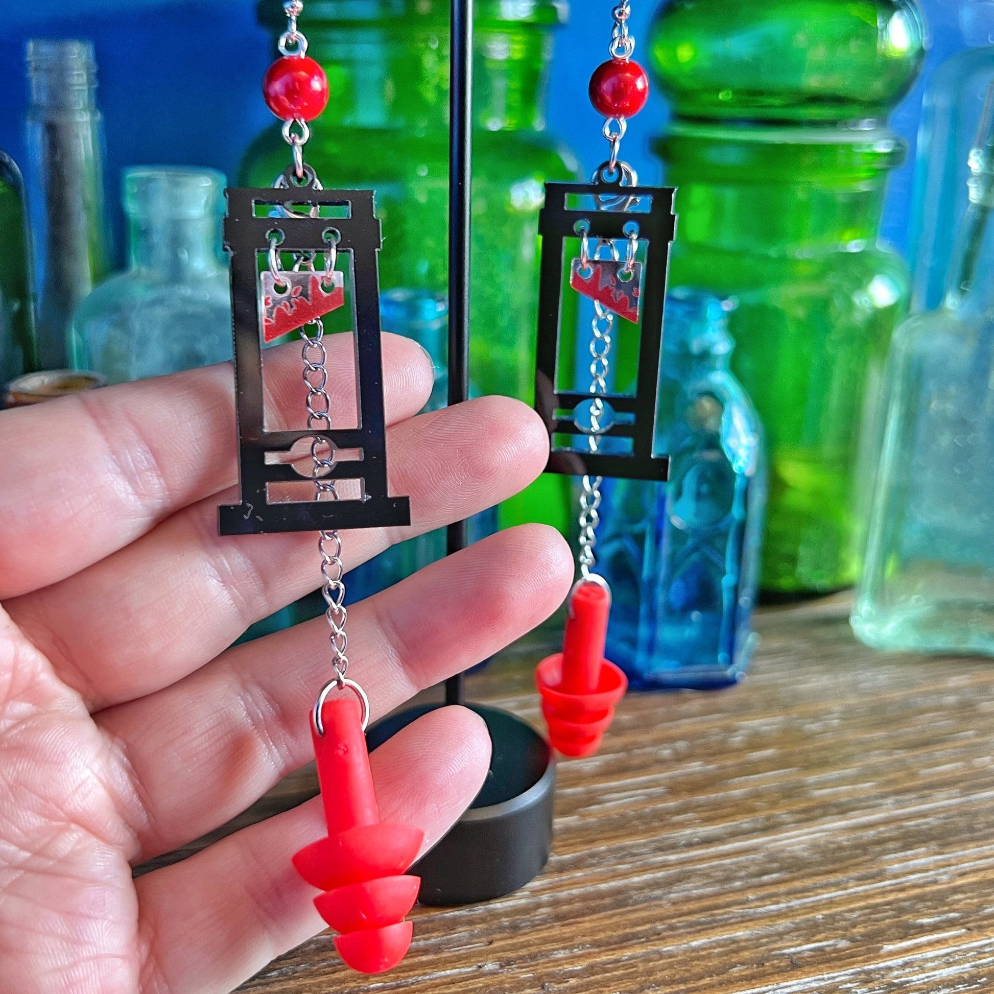 Boucles d'oreilles Guillotine – Style audacieux avec support sensoriel intégré 