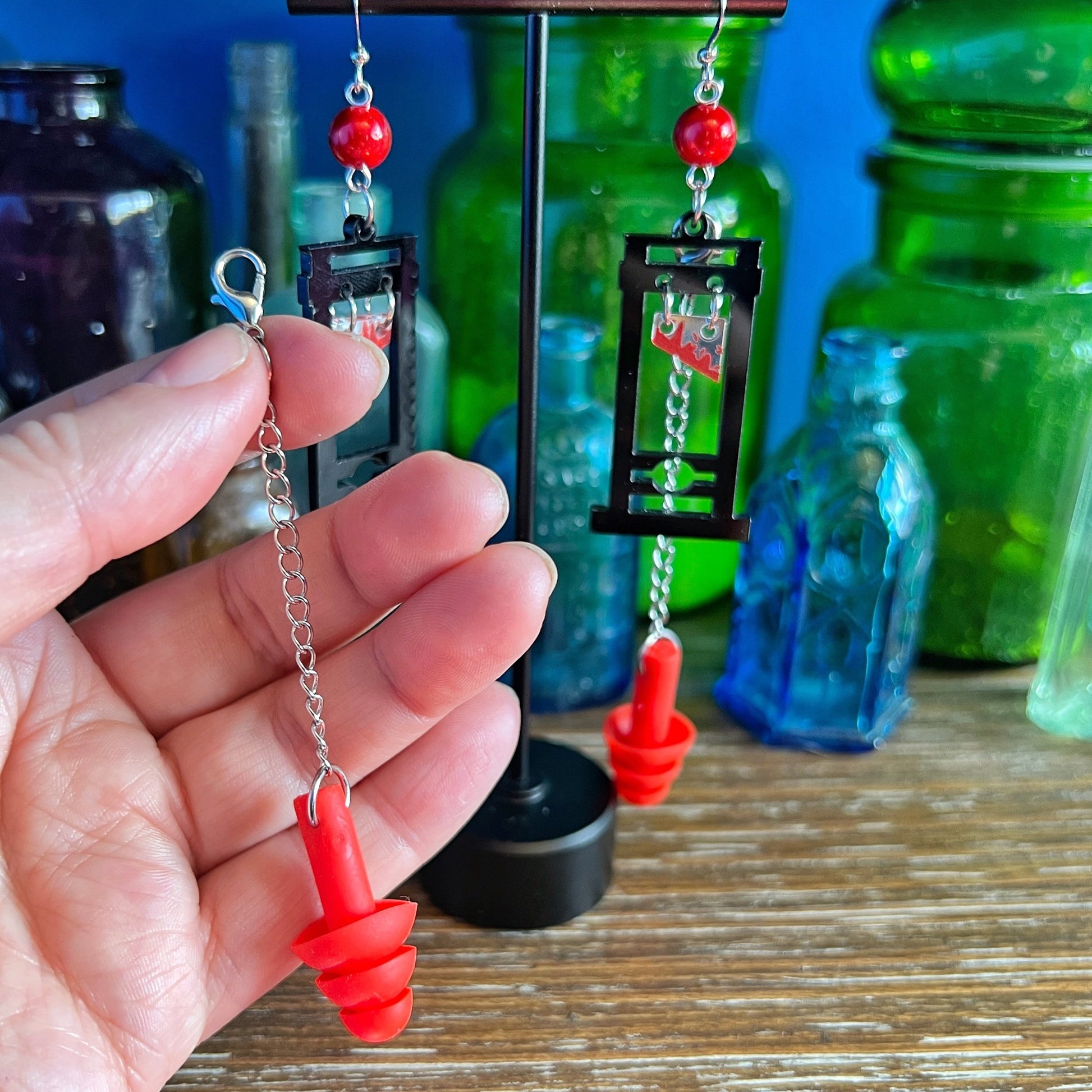 Boucles d'oreilles Guillotine – Style audacieux avec support sensoriel intégré 