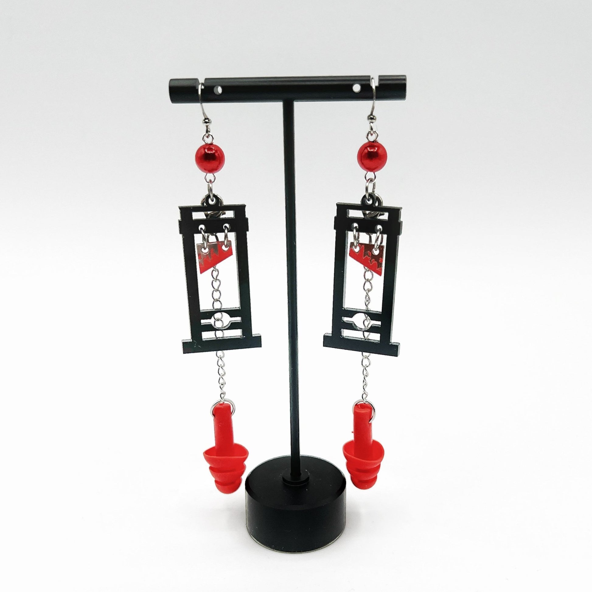 Boucles d'oreilles Guillotine – Style audacieux avec support sensoriel intégré 