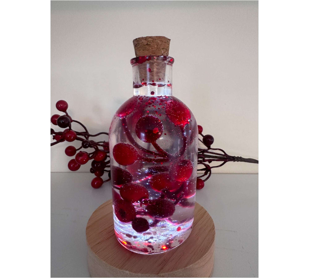 Magie des baies dans une bouteille - Décoration artisanale aux baies rouges pétillantes avec lumière