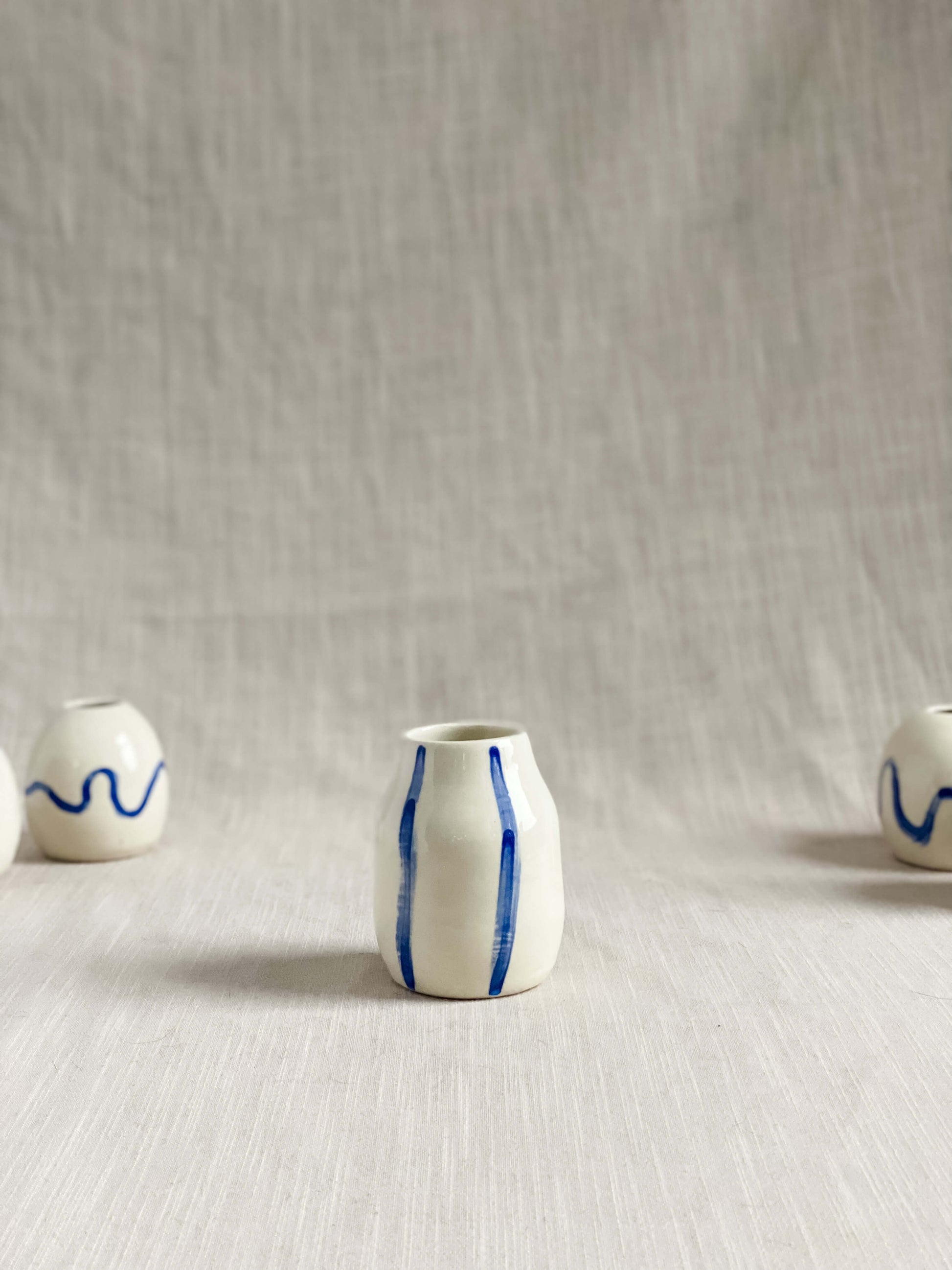 handmade pottery white porcelain bud vase hand painted blue stripes 