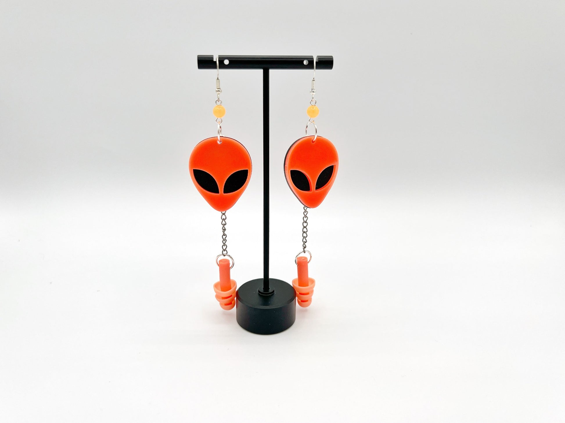 Boucles d'oreilles tête d'alien orange fluorescentes UV – Style extra-terrestre et soutien sensoriel 