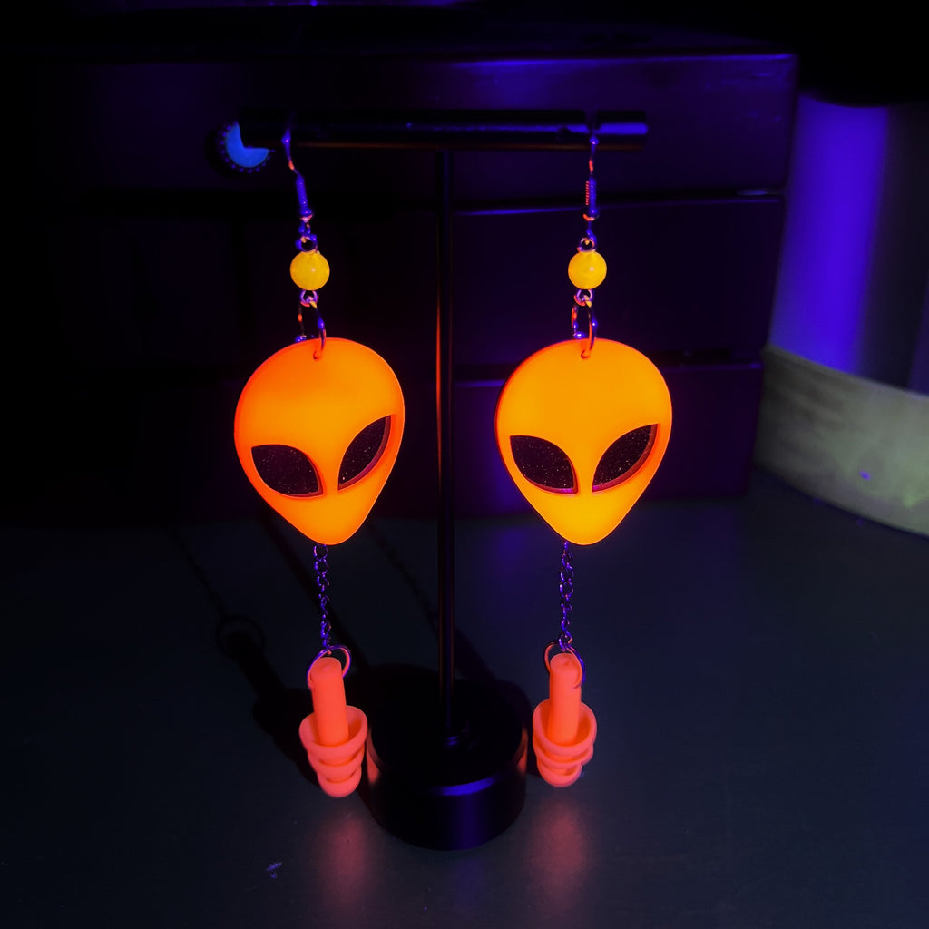 Boucles d'oreilles tête d'alien orange fluorescentes UV – Style extra-terrestre et soutien sensoriel 