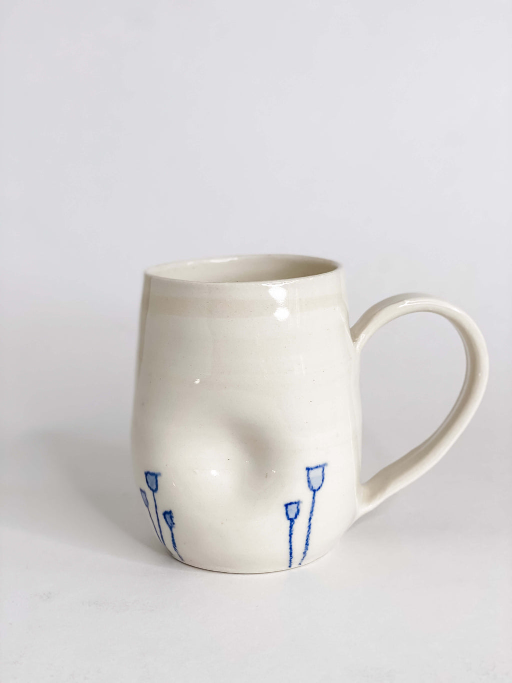 Indented Blue Tulip Mugs in White Porcelain