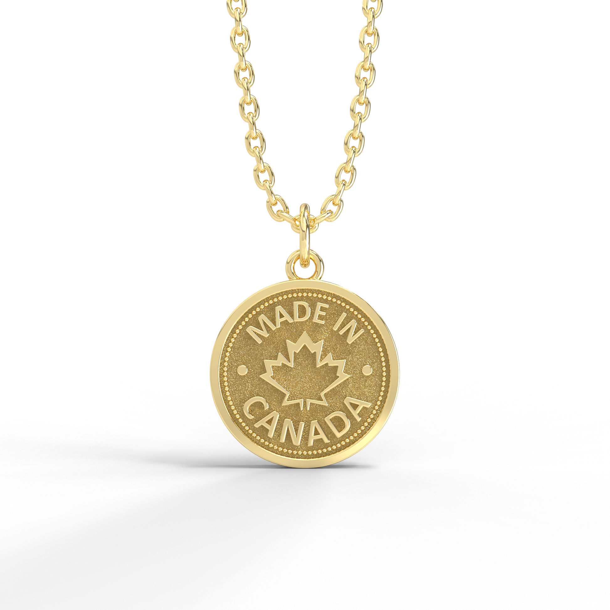 Pendentif en forme de pièce de monnaie fabriqué au Canada