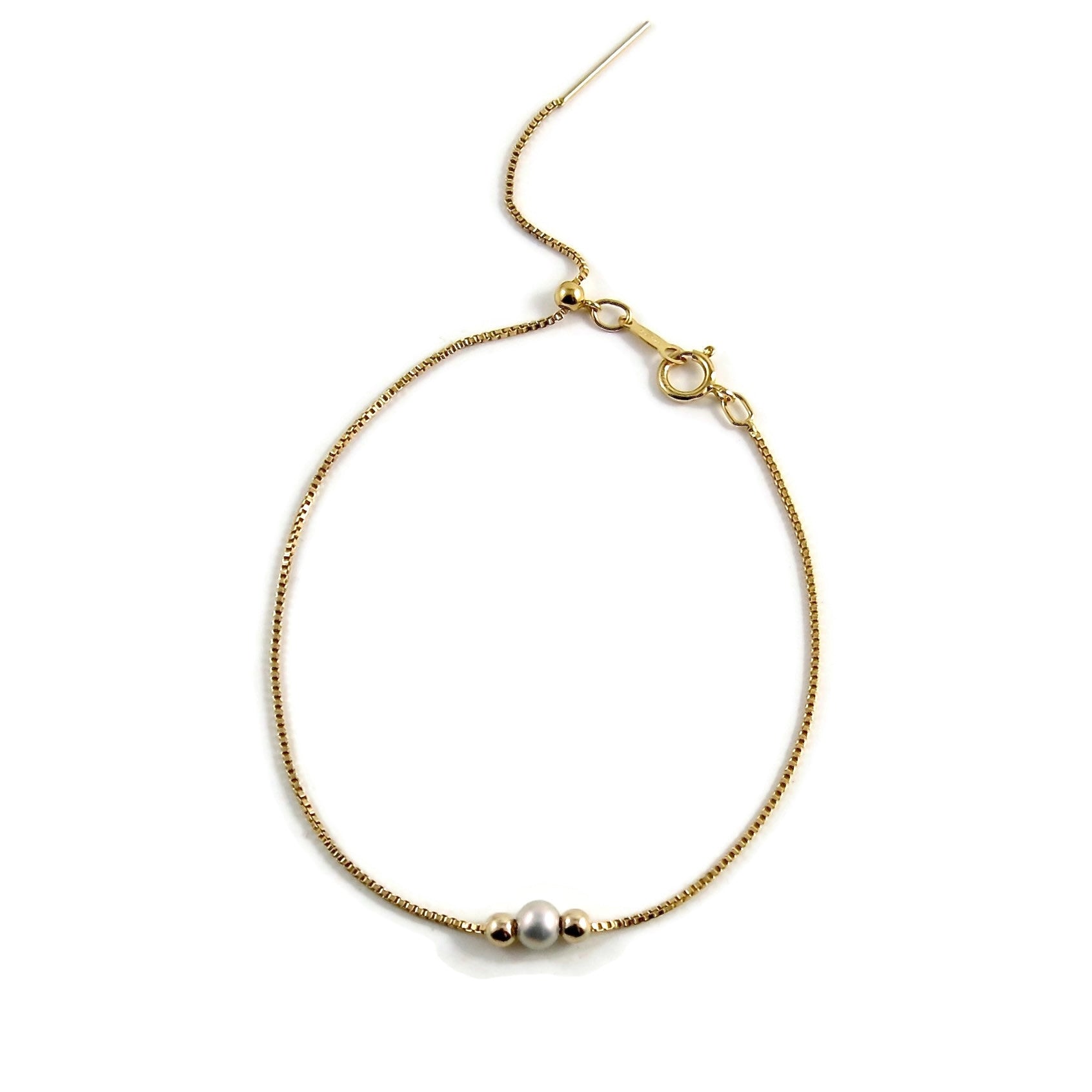 Bracelet coulissant réglable en or avec une petite perle rose, blanche ou grise