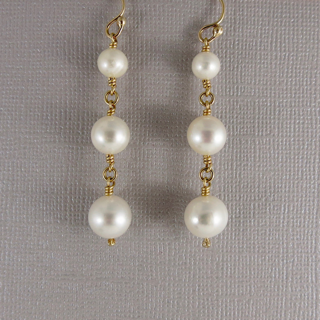 Boucles d'oreilles pendantes trio de perles • Or 14 carats