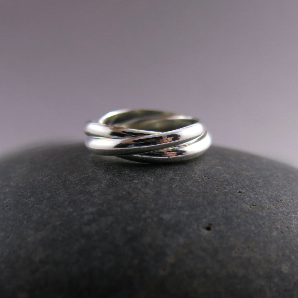 Bague trio de nœuds d'amour intemporels • Bague Trinity roulante en argent sterling