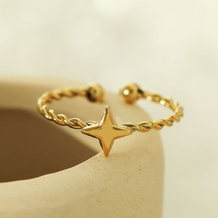NICOLE Gold: Textured Ring with a Four Point Star Centre Piece