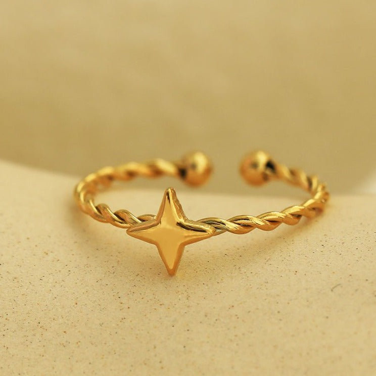 NICOLE Gold: Textured Ring with a Four Point Star Centre Piece