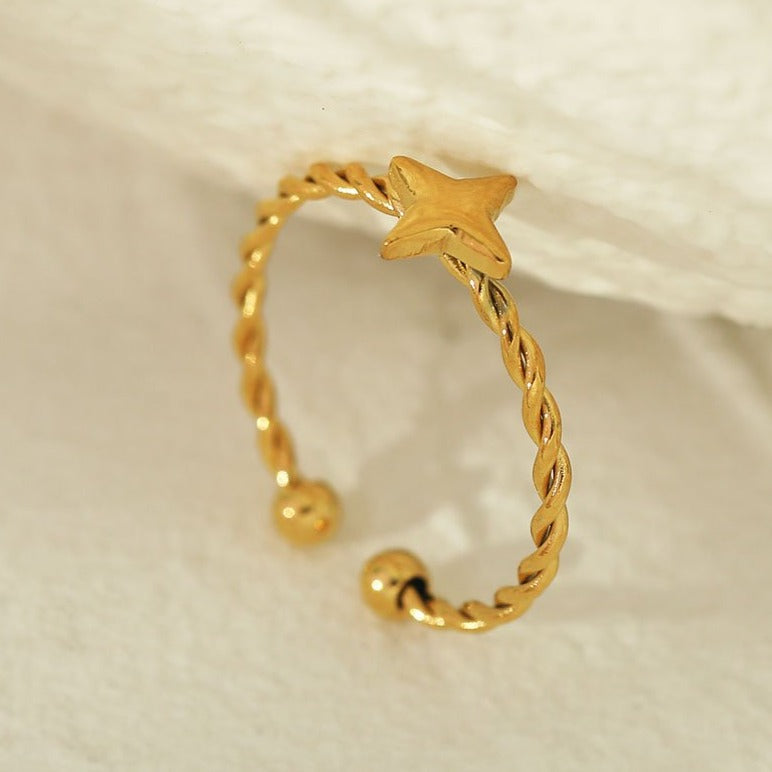 NICOLE Gold: Textured Ring with a Four Point Star Centre Piece