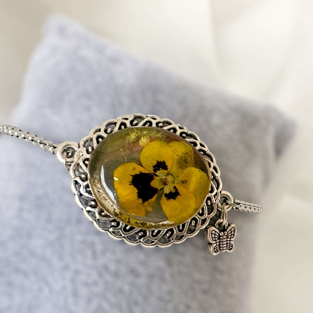 Silver Elegance: Handcrafted Resin Bracelet with Dried Flower Accents