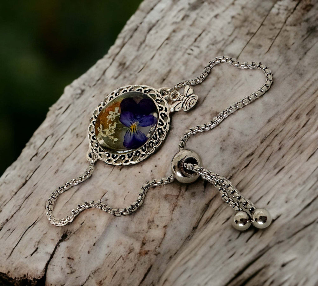 Silver Elegance: Handcrafted Resin Bracelet with Dried Flower Accents