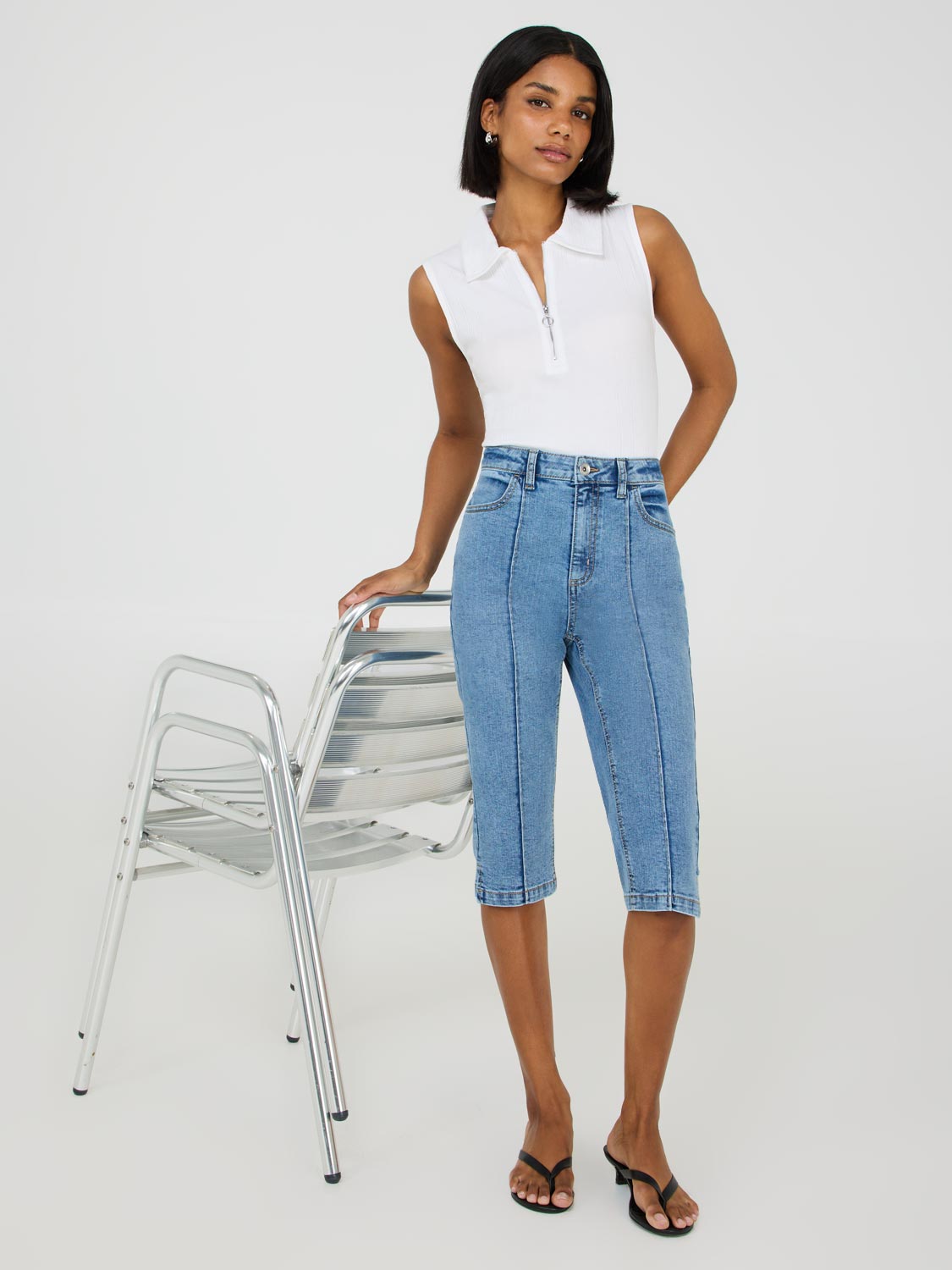 Polo sans manches à demi-zip