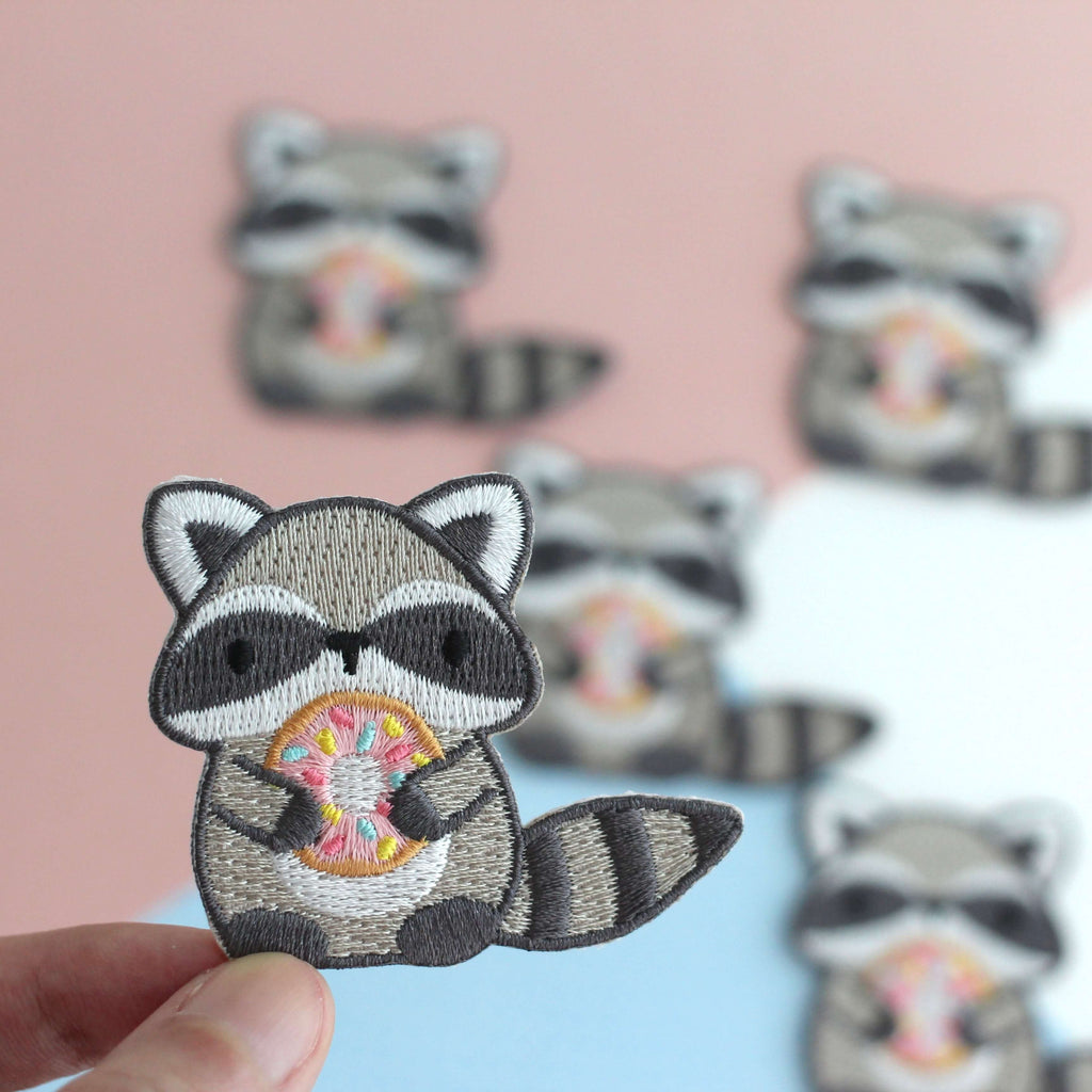 Raccoon Holding Donut Iron-On Embroidered Patch